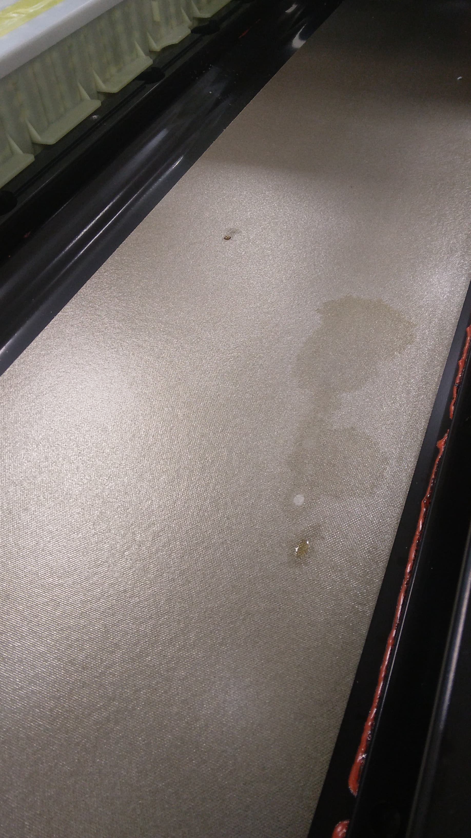 Electrolyte traces on the pack tray — the leak has gone far